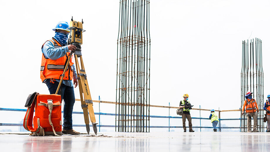 A construction worker uses a GTL-1200 to verify measurements on a concrete deck