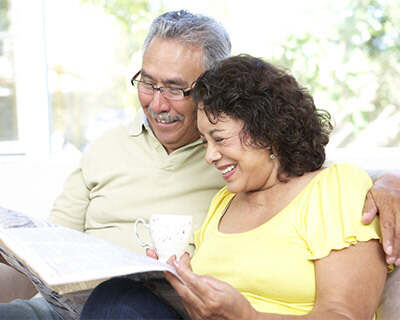 Photograph of older couple reading together