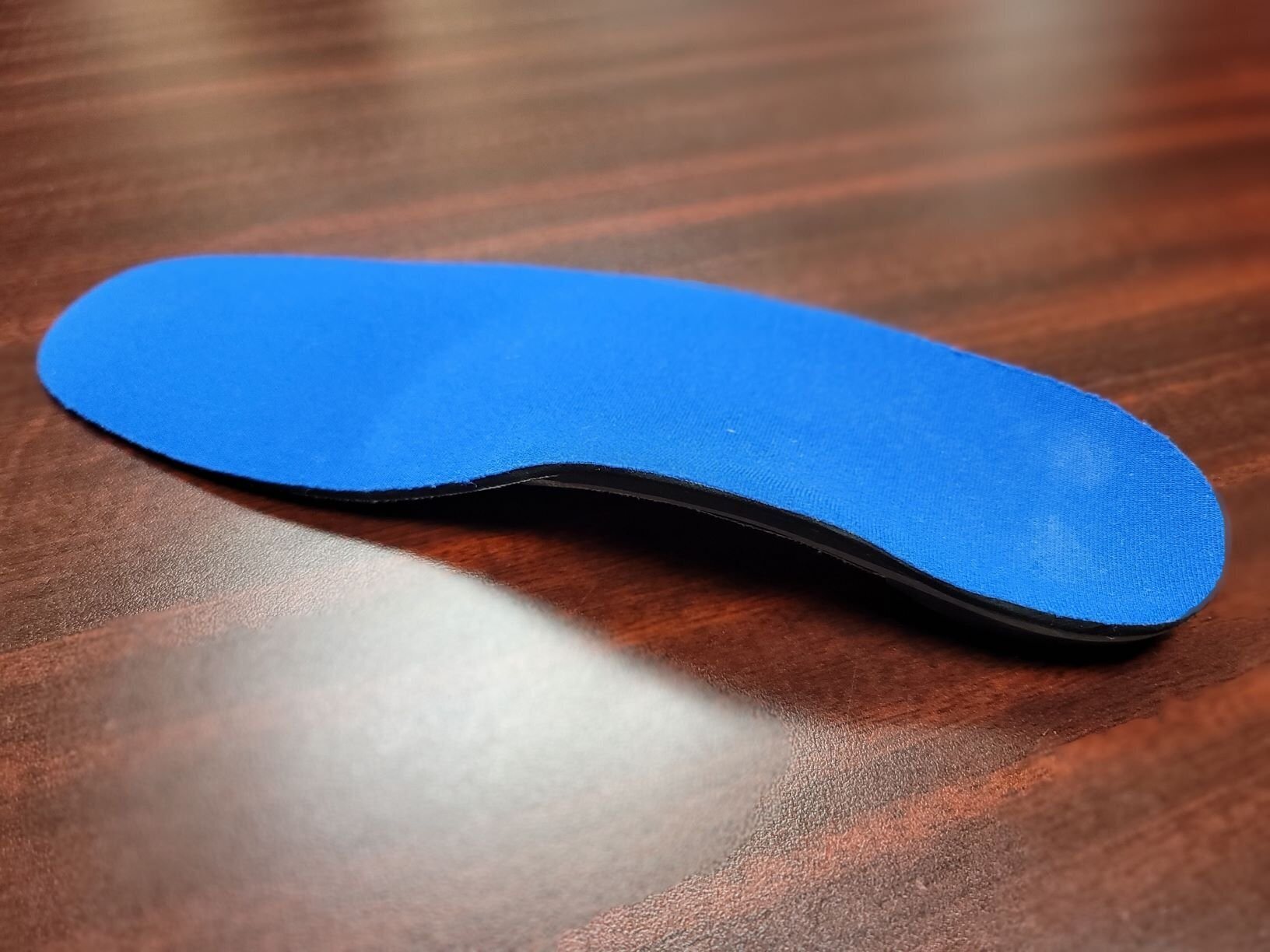 custom foot orthotic to insert into a shoe to support a flexible flat foot