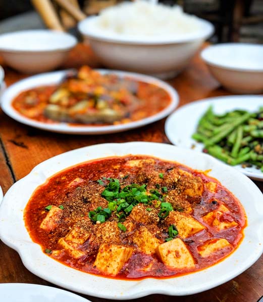Mapo tofu and other food on a table in Chengdu, China