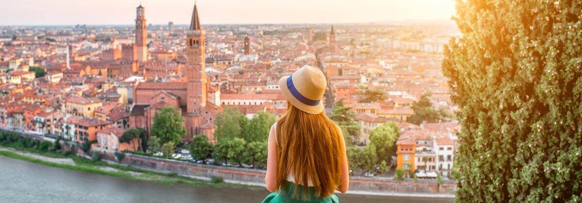 A woman looking at the cityscape of Verona, Italy