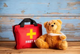 First aid kit and teddy bear