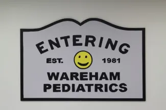 Sign: "Entering Wareham Pediatrics. Est. 1981"