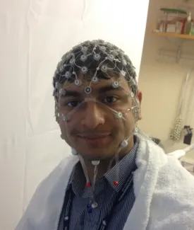 Archis wearing an EEG hat.