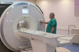 Technician works with MRI machine