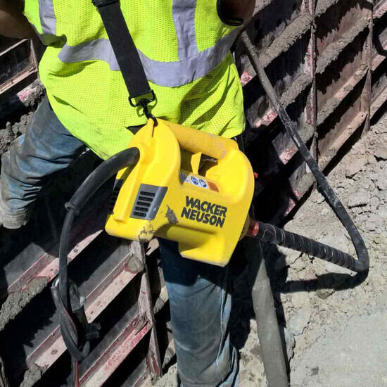 Carrying strap for Wacker concrete vibrator motors in use