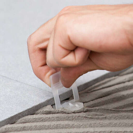 Raimondi RLS clip setting in mortar ceramic tile laying lippage free