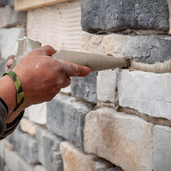 Applying Mortar to Brick Wall with ProGrade Disposable Bags