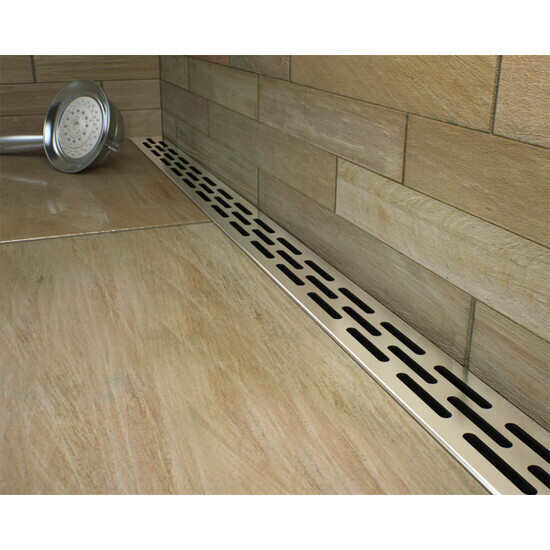 Low profile linear shower drains with slotted strainer
