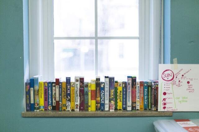 Books on a bookshelf in a City Year school