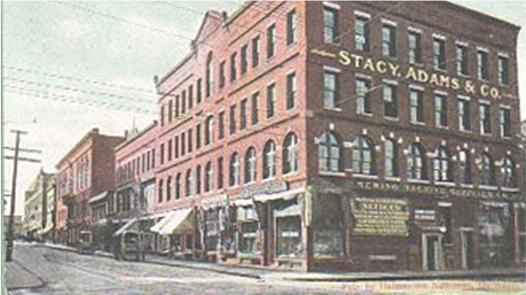 The featured image is a Stacy Adams factory in Brockton, Massachusetts from the early 1900s.