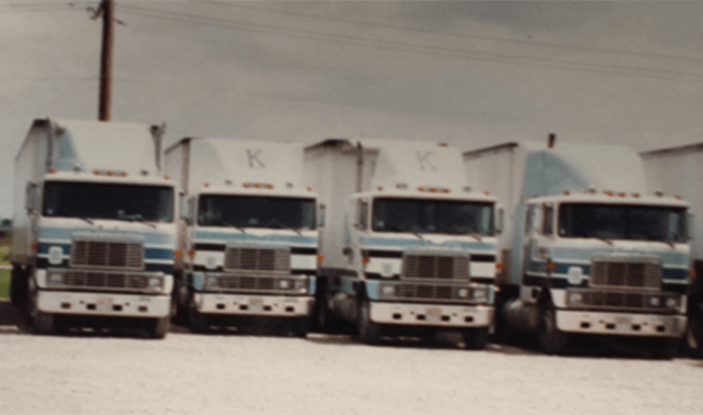 Four 1980s style Keller Trucking Semi Tractors lined up 