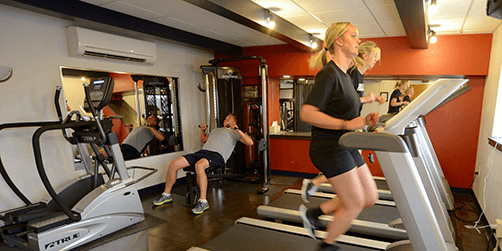 Employees using the fitness room provided as part of Keller Logistics Group's employee wellness program