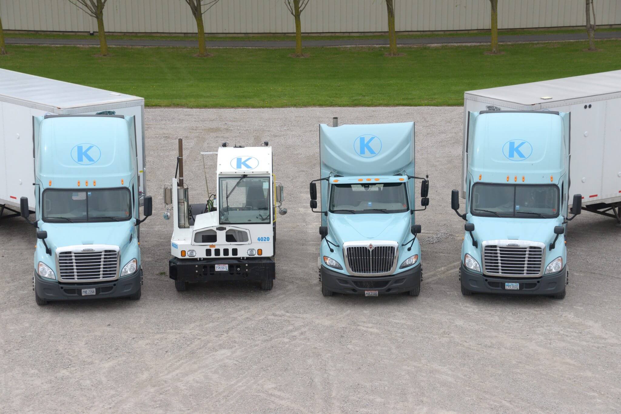 Four Keller Trucking tractors lined up to show the variety of capacity we can provide