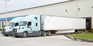 Keller Trucking Semi Truck backing into dock delivering shipment 