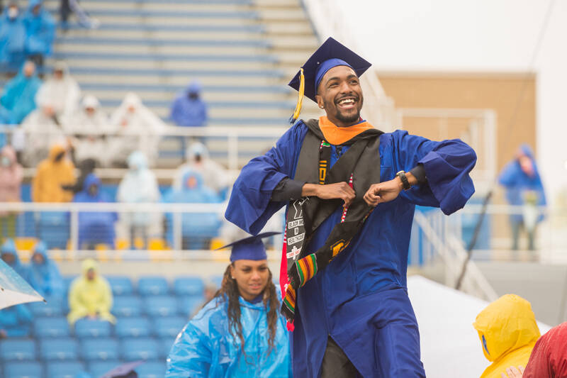 UD graduates smiled amid the rain (no lightning) on Saturday morning, May 29, as they received their diplomas.