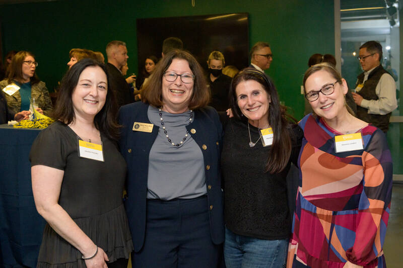 Lerner College Deputy Dean Sheryl Kline (second from left) connects with alumni and friends. 
