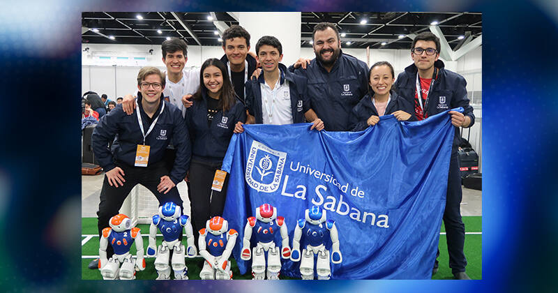 Andres Ramirez-Jaime (far left) poses with his teammates from the University of La Sabana (from left to right) Omar Sanchez, Valentina Diaz, Nestor Porras, Andres Coronado, Julian Echeverry, Jenny Robayo and Juan Cuevas after placing second at the world RoboCup in Australia in 2019.