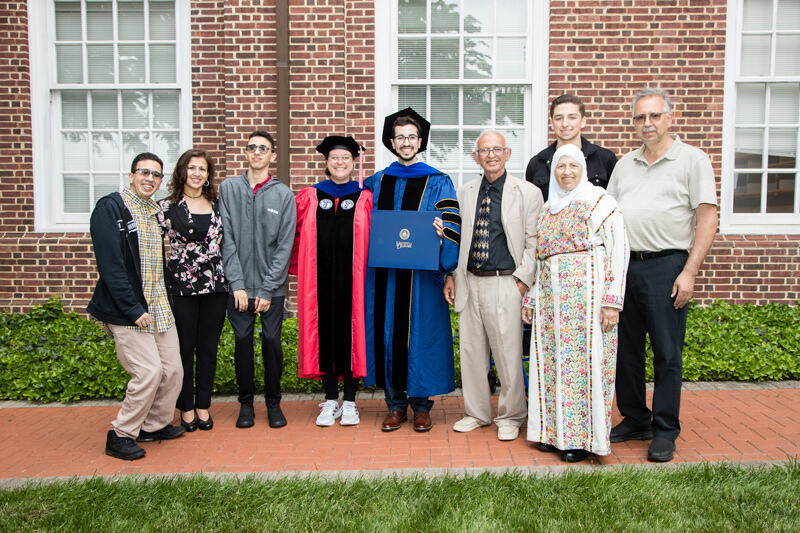 Bader Jarai earned his doctorate in chemical engineering. Though his parents could not get a visa to travel from Palestine for the ceremony, many family members joined the  celebration. From left to right: Samy Suqi, Alia Suqi, Salah Suqi, Catherine Fromen, assistant professor of chemical and biomolecular engineering and adviser to Bader Jarai, Kaled Jarai, Mariam Suqi, Joseph Rush and Isa Suqi.
