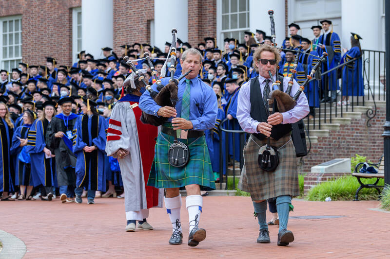 Bagpipers Russell Johnstone (left) and Mark Hurm (right) start the procession as the Doctoral Hooding Ceremony begins.