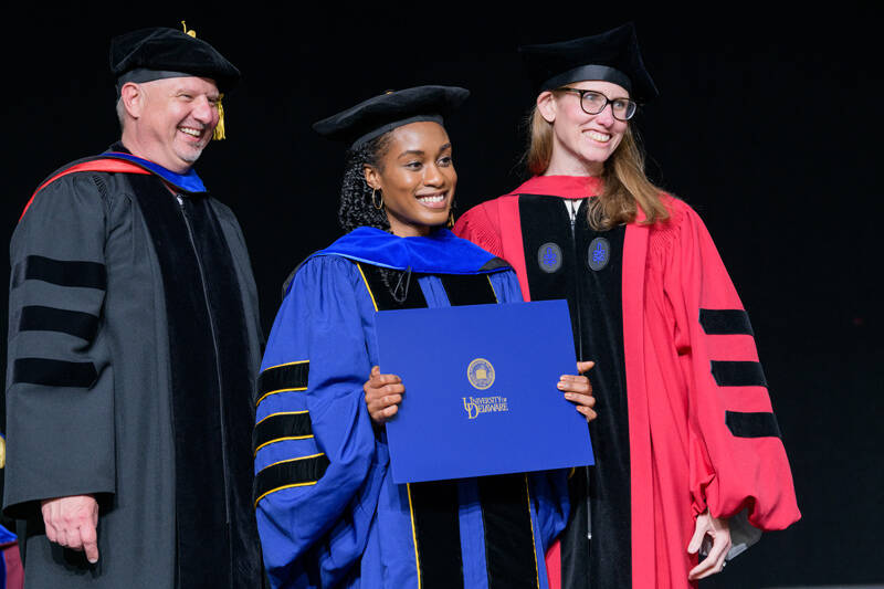 The Doctoral Hooding Ceremony is one of the happiest events of UD’s academic year, as you can see on the faces of John Pelesko, dean of the College of Arts and Sciences, Ashley Rochelle Brown, who received her doctorate in chemistry and biochemistry, and Brown’s adviser, Catherine Leimkuhler Grimes, professor of chemistry and biochemistry.