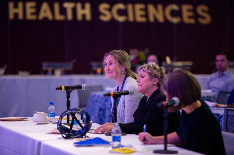 From left to right, First Step judges Freda Patterson, associate professor of Behavioral Health and Nutrition; Shardon Dudley-Brown, associate professor in the School of Nursing; and Jocelyn Hafer, assistant professor of Kinesiology and Applied Physiology, listen intently to students’ presentations that aim to solve real-world healthcare challenges.