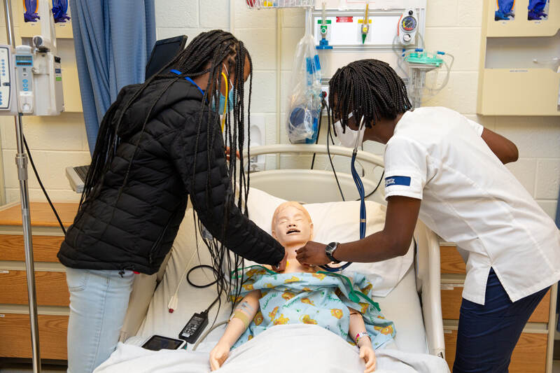 Students in the Brandywine Lifesavers program learn how to check for vital signs through a partnership with UD’s School of Nursing that serves as a pipeline initiative that aims to pique students’ interest in nursing careers, including students from underrepresented groups.