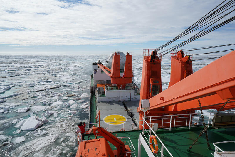 Researchers, including UD’s Zhangxian Ouyang, traveled aboard the icebreaker R/V Xue Long into an active melting zone in the Arctic Ocean to get samples for analysis.