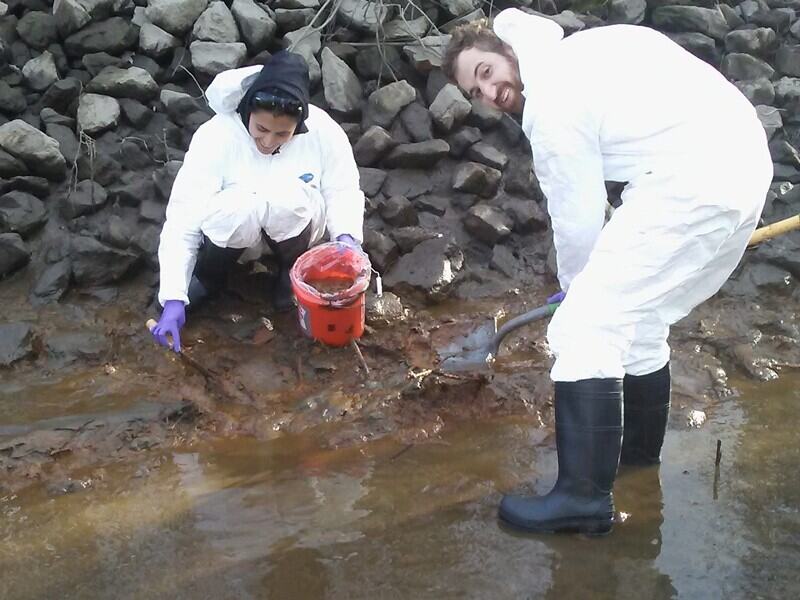 Izaditame (left) collected soil and river sediment samples from an industrial site on the banks of the Christina River adjacent to an EPA Superfund site. Arsenic, a highly mobile heavy metal often found in abundance at sites such as this, poses a threat to the safety of water systems and is of increasing importance in the face of sea level rise predictions.
