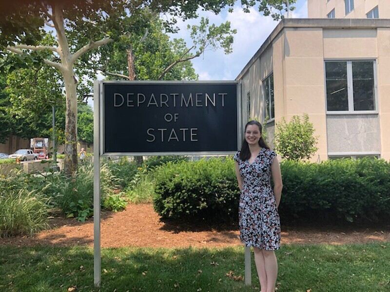 UD senior Megan Fuglestad stands outside the U.S. Department of State where she has held four internships and hopes to begin a career after graduation. 