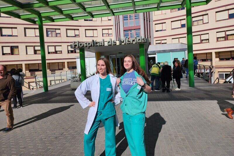 Kristelle Juhasz, a junior biology major, and Shannon Eberle, junior MDD-Pre-PA major, pose outside Hospital de Mérida in Spain, where they completed their International Healthcare Practicum over Winter Session.