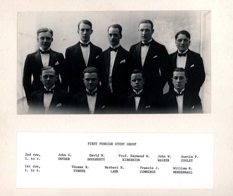 The first foreign study group posed in 1923 in formal attire. First row, left to right: Thomas R. Turner, Herbert H. Lank, Francis J. Cummings, William K. Mendenhall. Second row, left to right: John C. Snyder, David M. Dougherty, Prof. Raymond W. Kirkbride, John W. Walker, Austin P. Cooley.