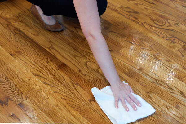 Woman drying off clean hardwood