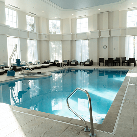 Indoor pool at hotel with tile floors