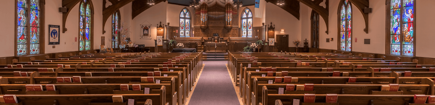 Religious facility facing the altar with rows of pews