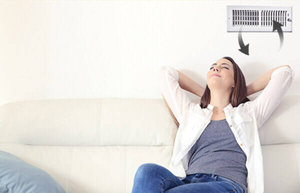 Woman breathing clean indoor air
