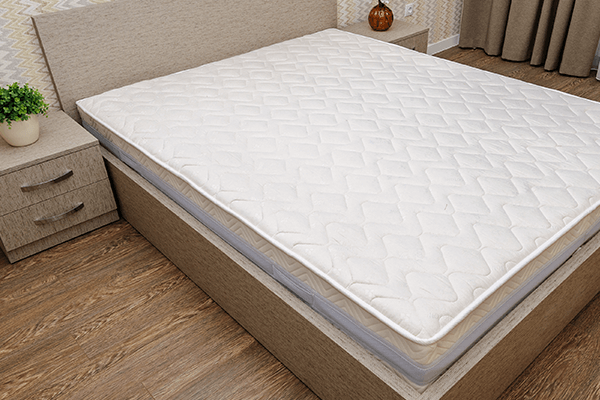 Plain mattress on a bedframe