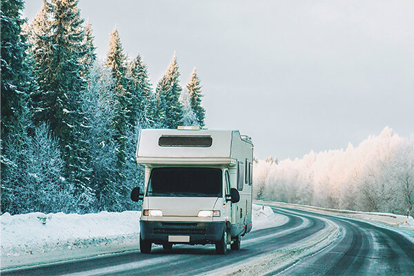 RV driving on snowy road