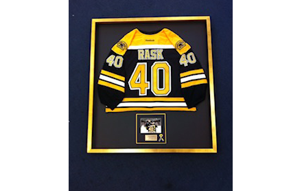 Custom framing for an athletic jersey made by Cambridge Art & Frame.