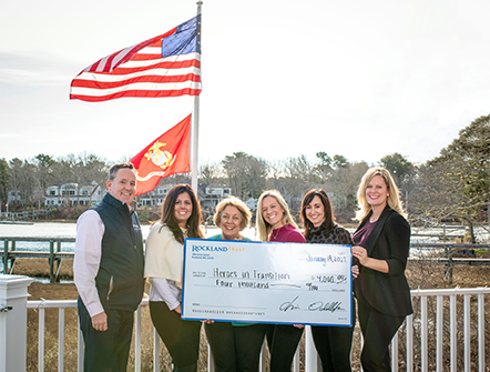 Members of Heroes in Transition posing with their four thousand dollar check from Rockland Trust's Charitable Foundation.