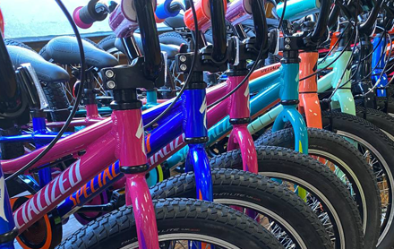A row of colorful bikes sold by Serious Cycles.
