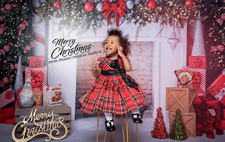 Toddler posing in a holiday themed photoshoot directed by Phases Creative Studios.