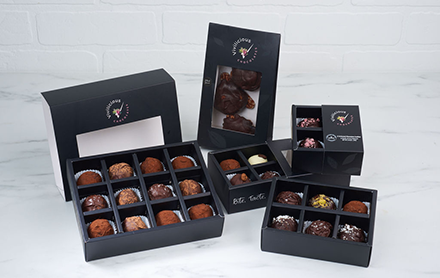 Box assortment of chocolate truffles sold by Vivalicious Chocolates.
