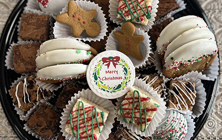 An assortment of Christmas-themed, handmade dessert treats by Yummy Mummy Bakery.
