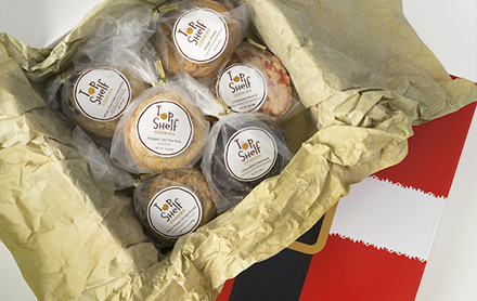 12 days of Christmas cookie gift box featuring 12 holiday flavors sold by Top Shelf Cookies.