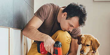 man working on house repairs
