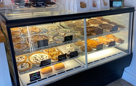 Assortment of pies and baked goods on display at Flaky Crust Pies.