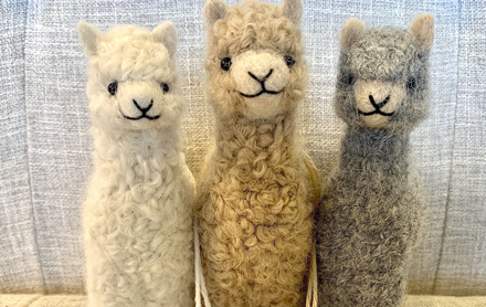 Three baby alpaca felted ornaments sold by Island Alpaca Co.