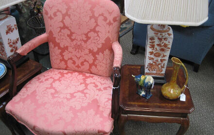 A pink vintage chair and vintage home decor sold at The Gallery at Post Office Square.