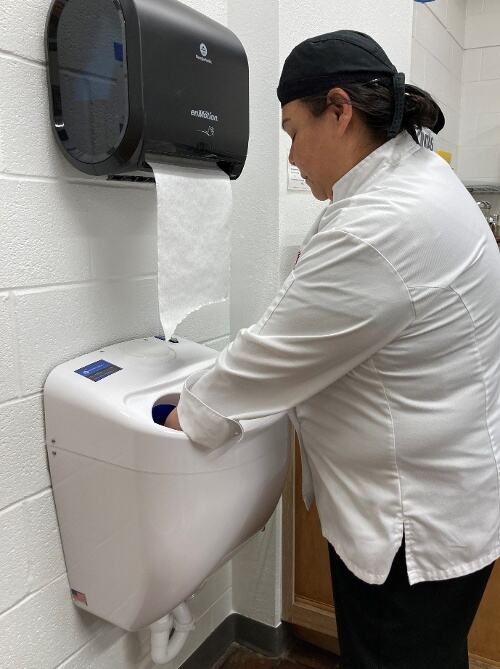 Person using the CleanTech® ELF system to wash their hands